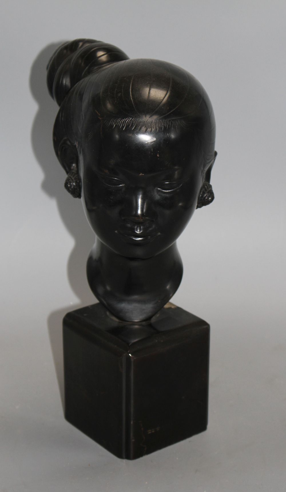 Nguyen Thanh Le (1919- Vietnam). A bronze head of a Vietnamese woman,